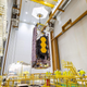 The Webb space telescope being hoisted to the top of an Ariane 5 rocket.